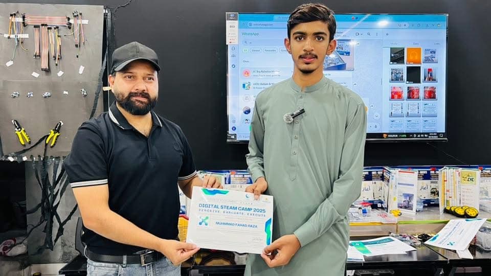 A Digital STEAM Camp 2025 certificate being presented to a student